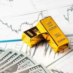 depositphotos_527739458-stock-photo-gold-bars-dollar-bills-rise